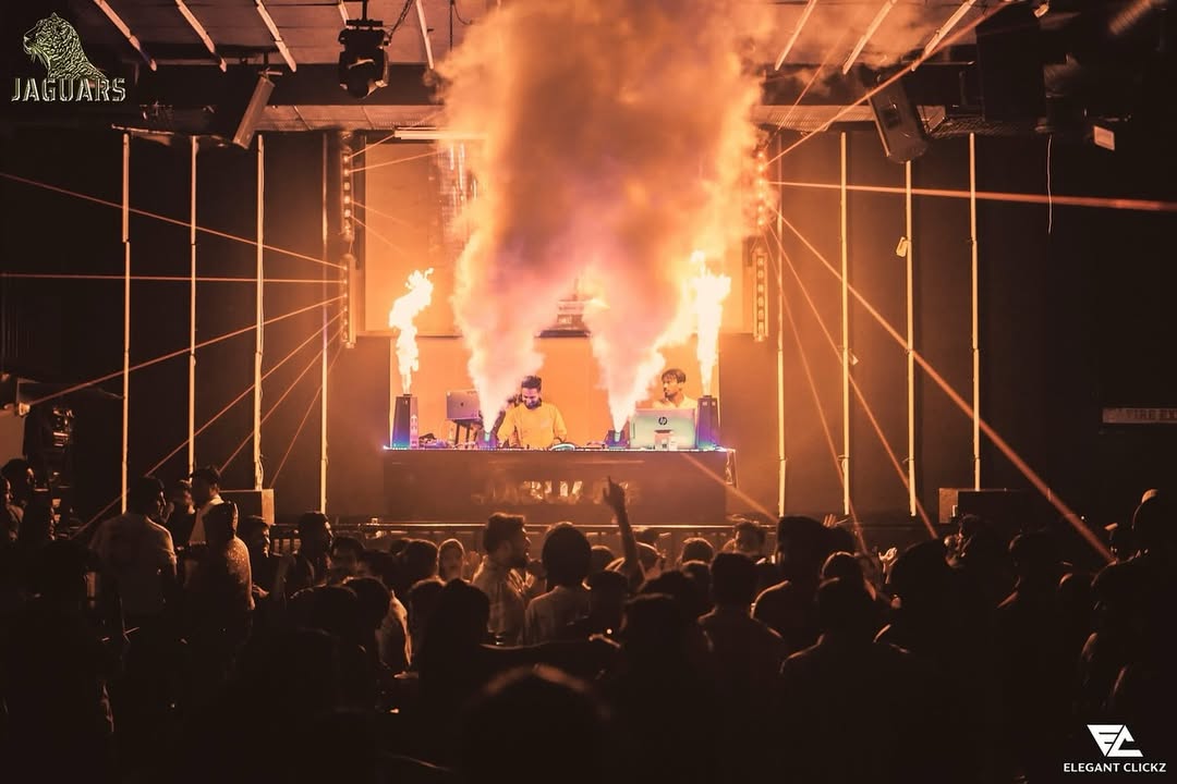 DJ mixing music at best night club dance floor