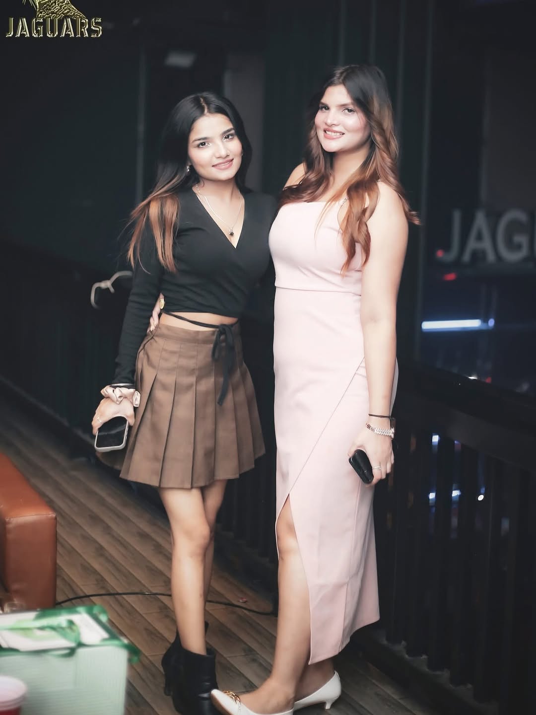 Party crowd having fun with friends and DJ music